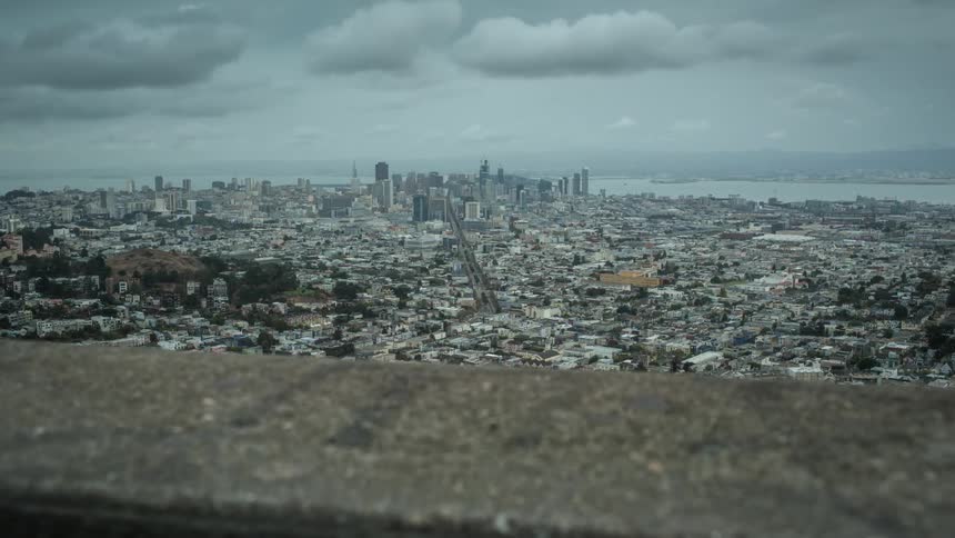 View of a large city from a distant rooftop