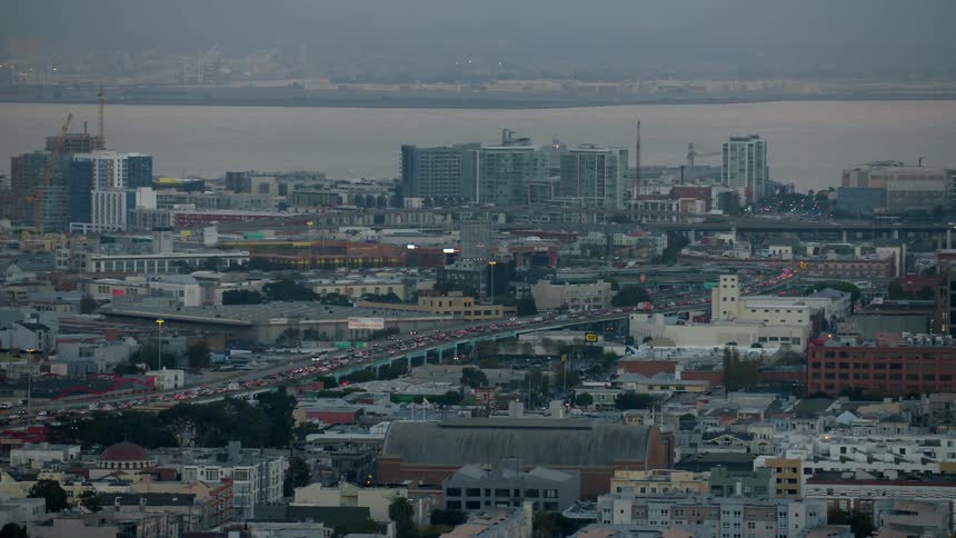 View of a busy city next to a body of water