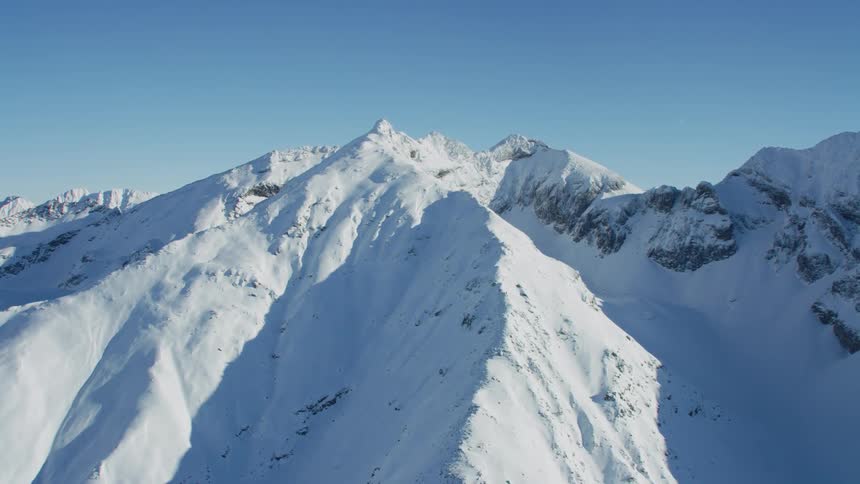 A view of snow on mountains during the winter