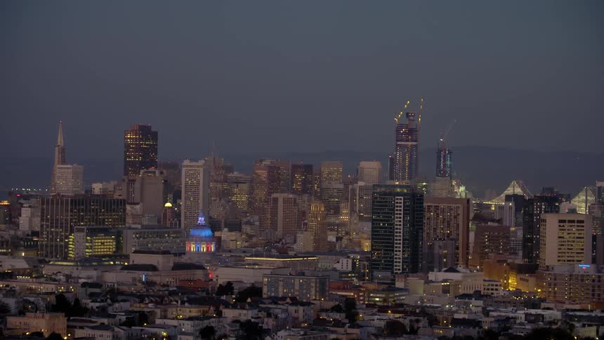 View of a city skyline as night falls