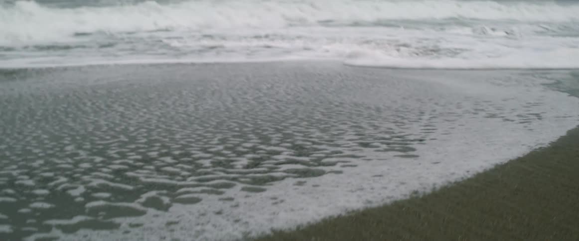 Waves crash against the shore