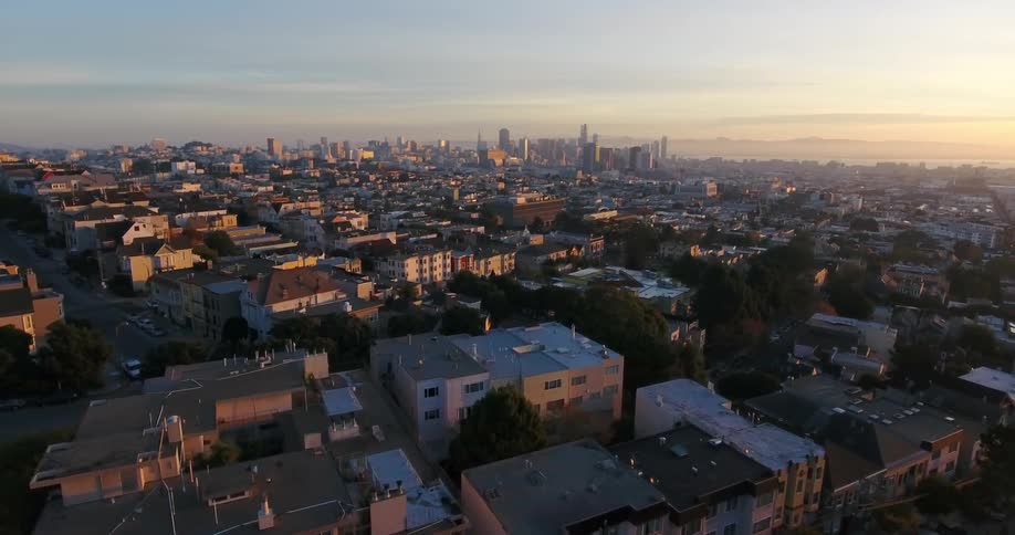 Aerial view of a large city at sunset