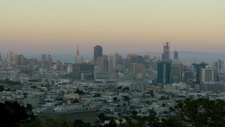 Aerial view of a large city at sunset