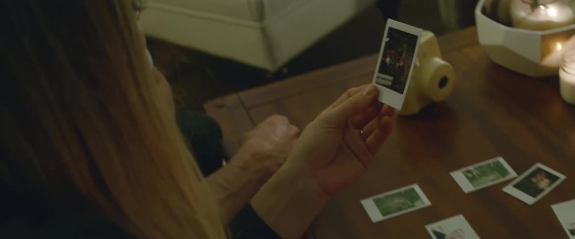 A man and women examine a picture