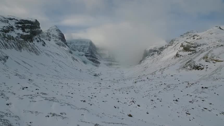 Snow covers a mountainous area
