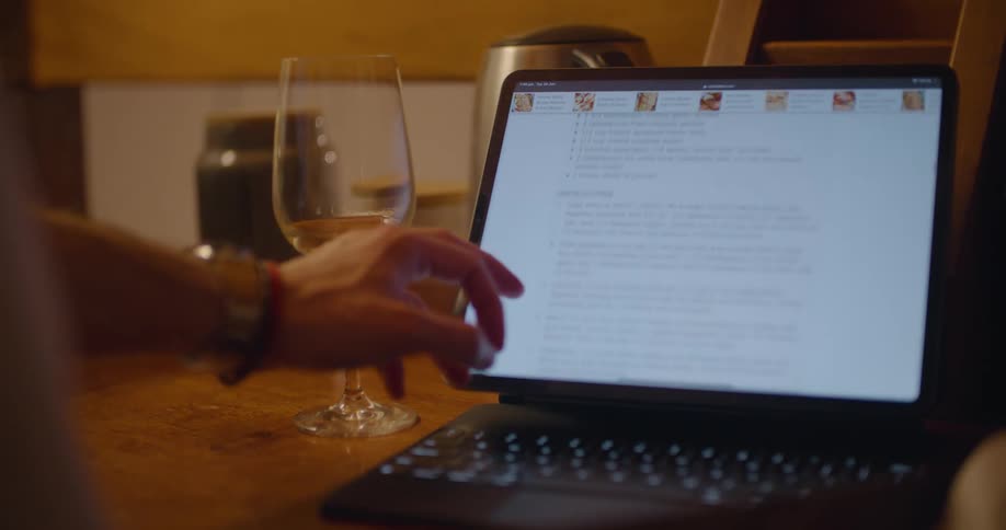 Woman uses her fingers to scroll on a laptops touchscreen