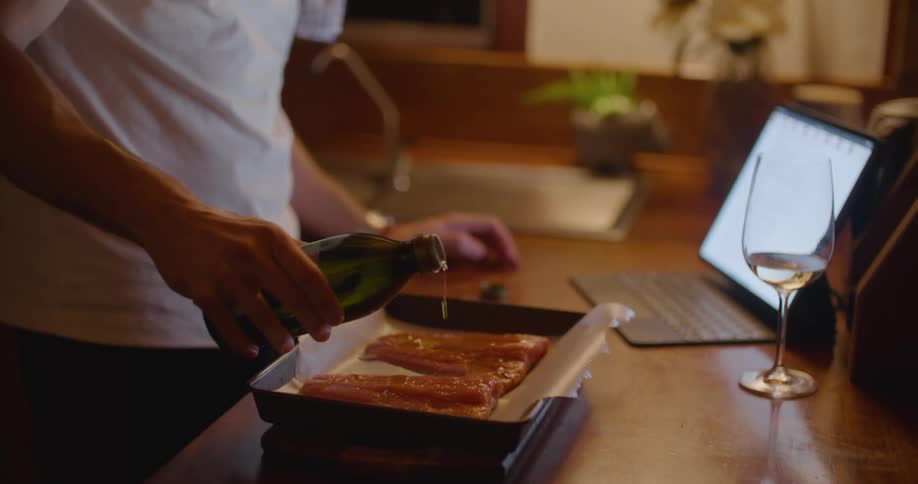 A man cooking food in a kitchen