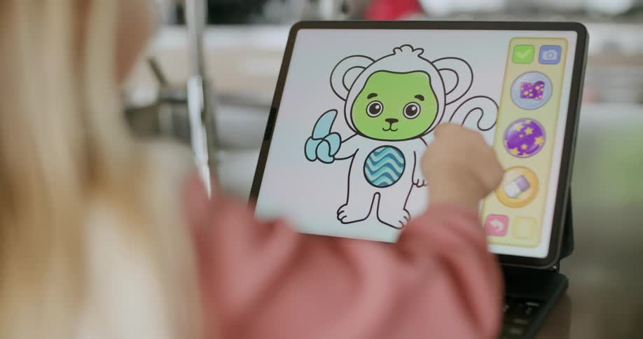 Blonde girl colors money image on tablet app