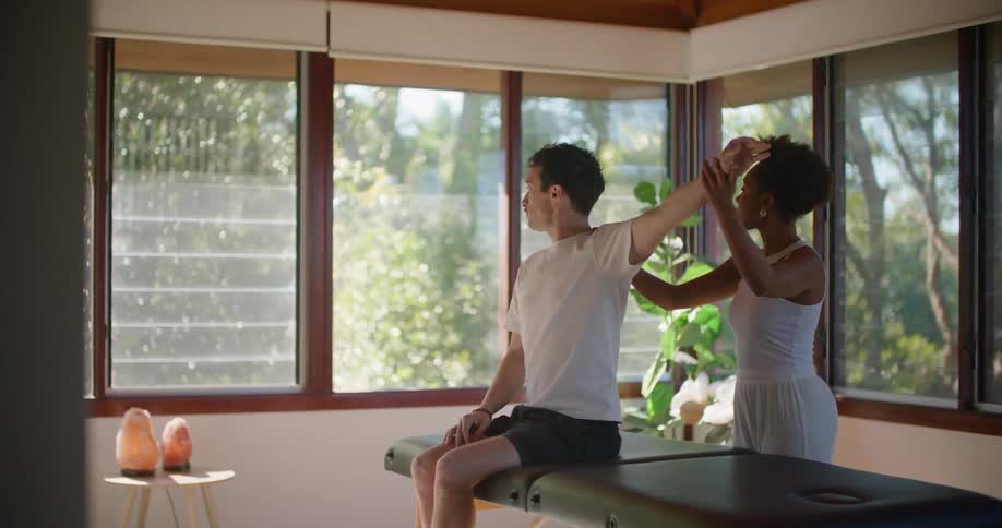 A man is receiving treatment in a massage parlor
