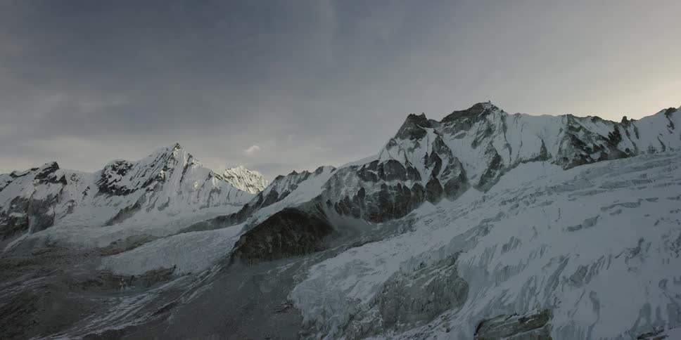 A snowy mountain during the day