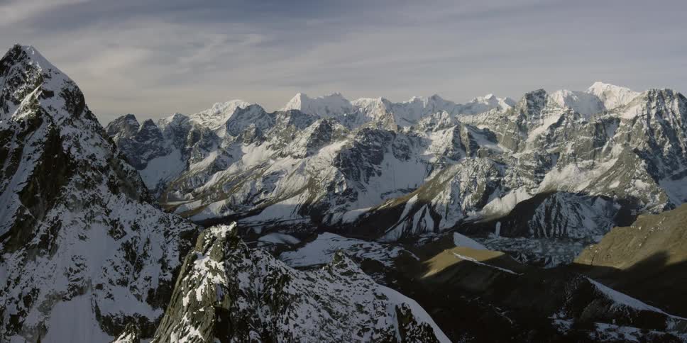 Snow covered mountains and valleys on a winter day