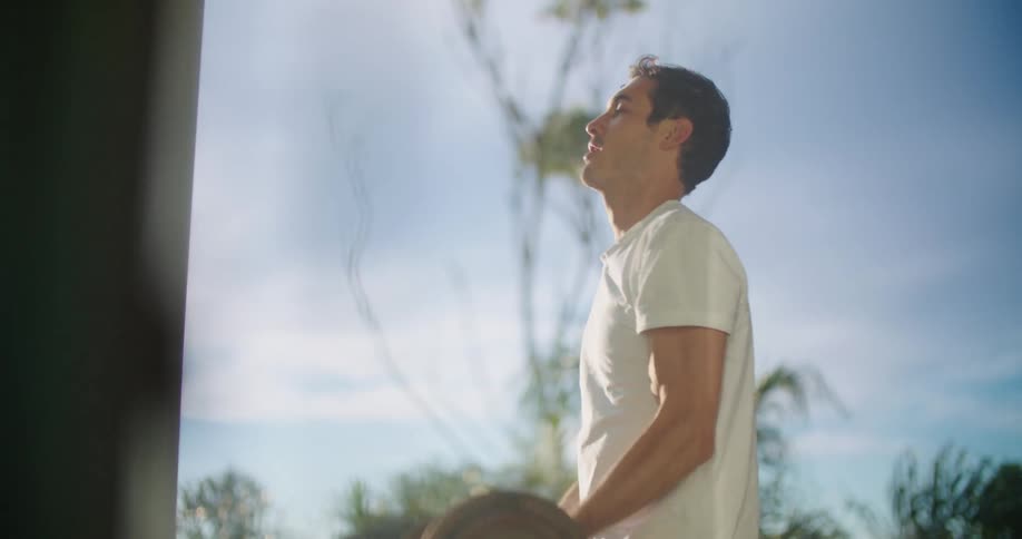 A man lifting weights outdoors