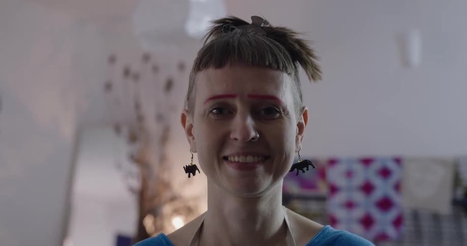 A portrait of a woman standing in a room