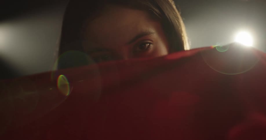 A woman is moving in slow motion indoors