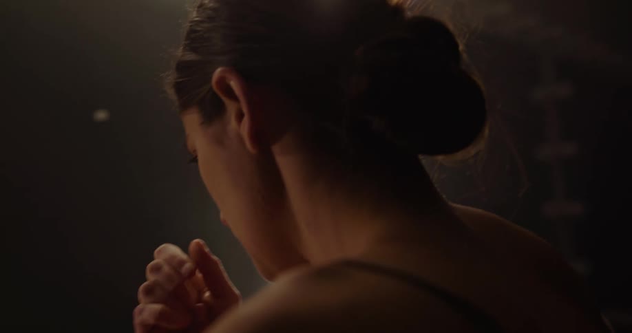 Woman looking into mirror