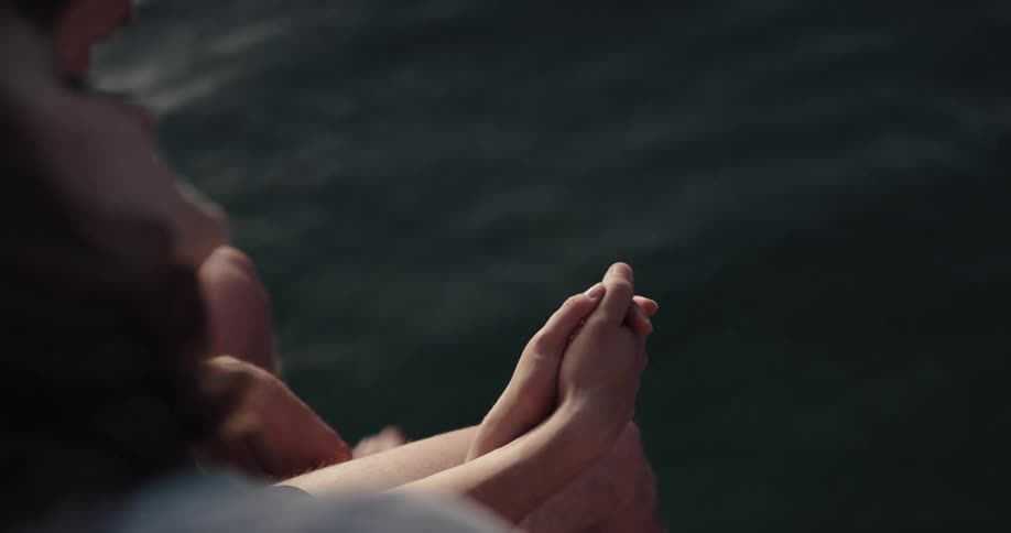 Woman and man holding hands