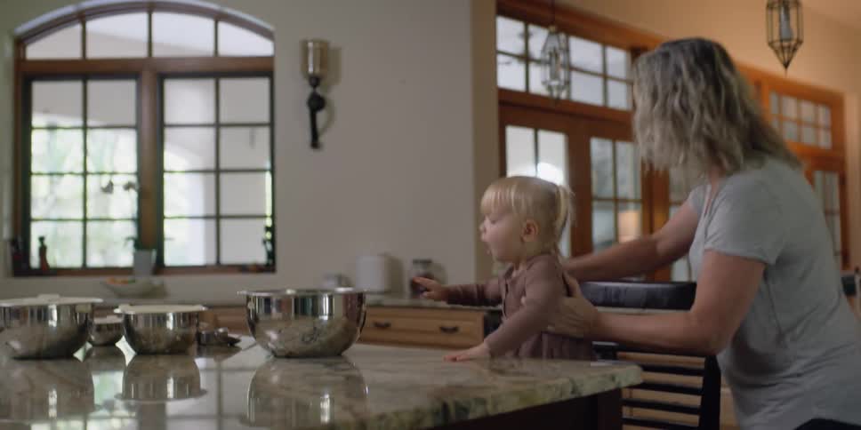 A mother and daughter in a kitchen