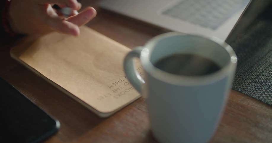 A steaming cup of coffee on a table