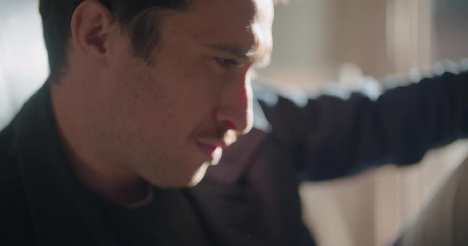 A man sitting around reading something