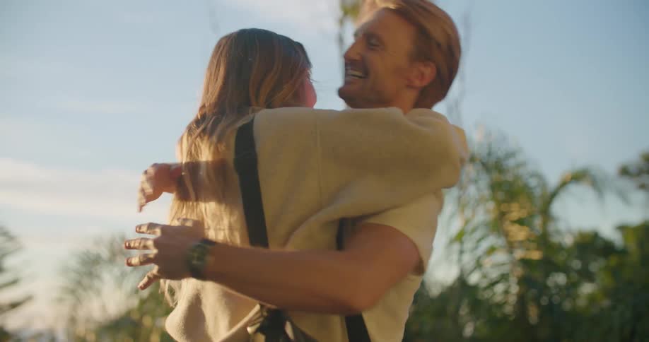 A man and woman hugging each other