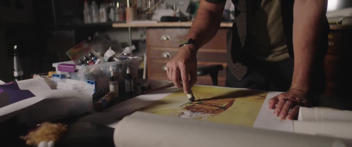 Male artist working on art