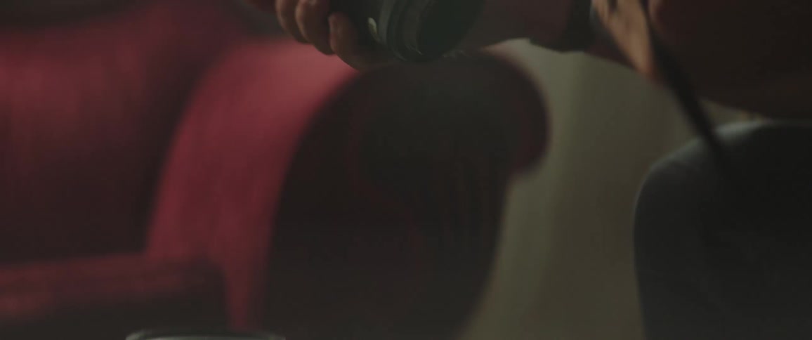 Man replaces one camera lens with another
