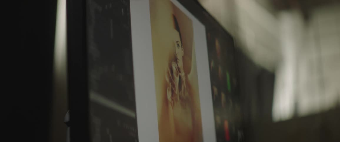A computer monitor displaying a stylish photograph of a woman