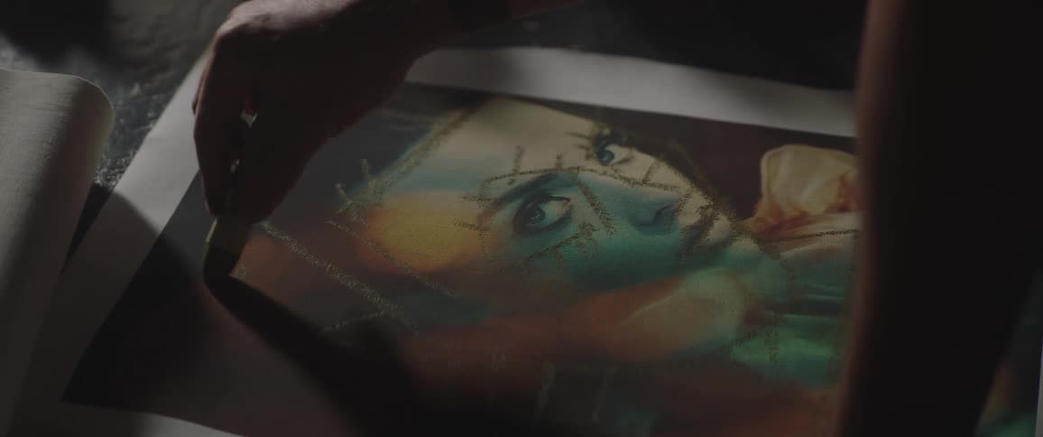 A person painting on a canvas