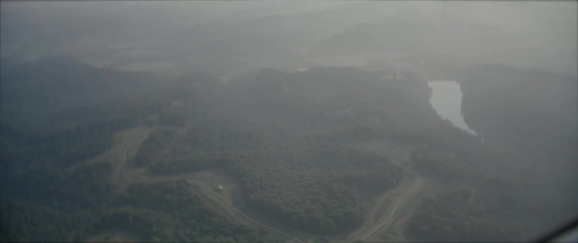Aerial view of a rural area is displayed at dusk