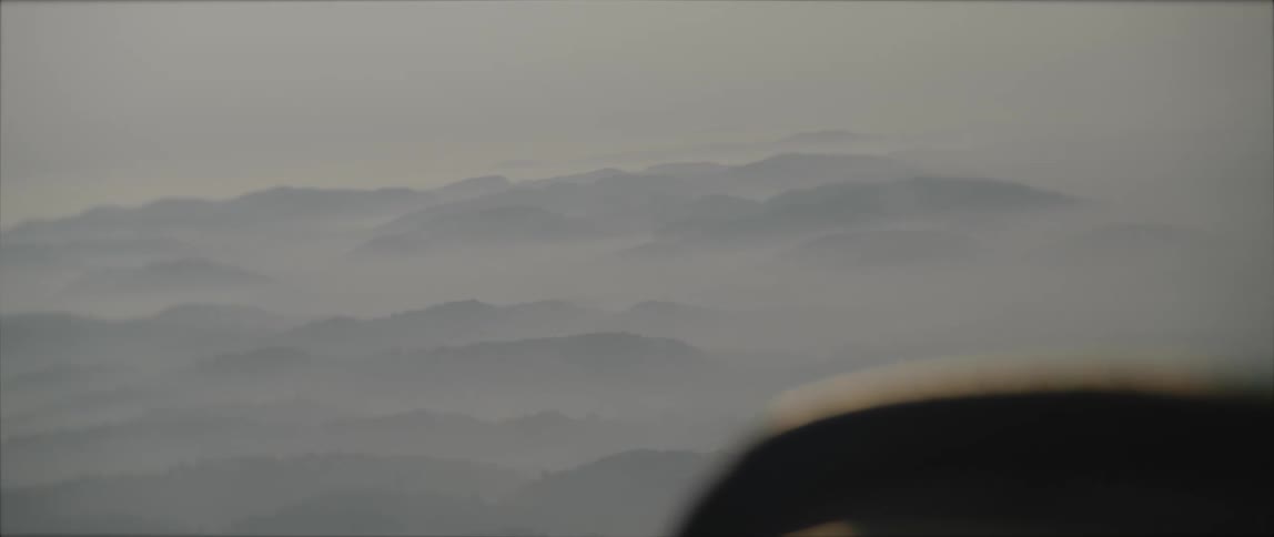 Airplane flies above the clouds