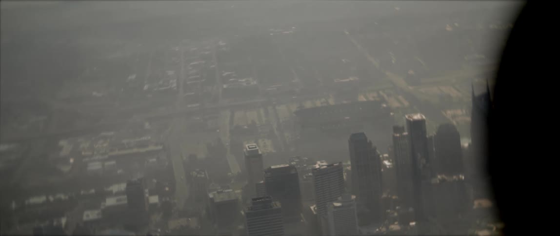 An aircraft with a city skyline buildings and skyscrapers in the background