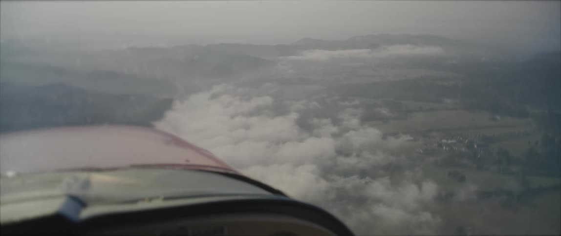 An aerial view of some hills with trees