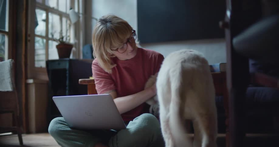 A woman petting a dog