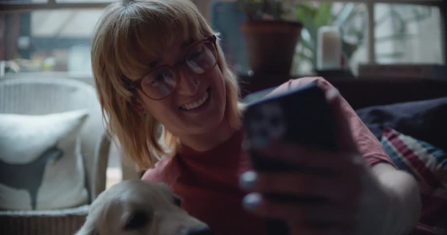 A woman takes a selfie with her dog