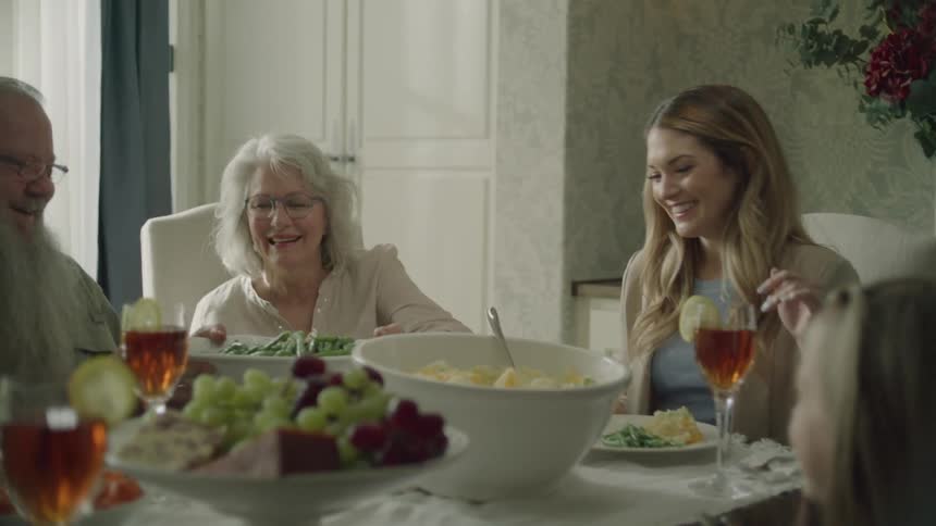 Food is passed around the family dinner table