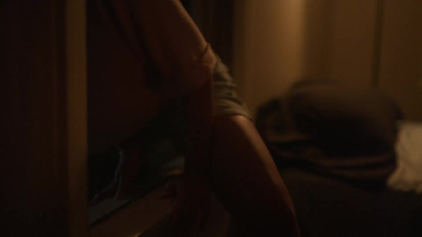 A woman climbs out of the window in her bedroom