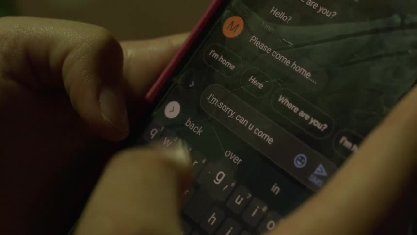 A person typing on a smartphone