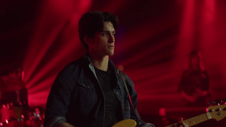 A guitar player is surprised by the reaction the band gets when they finish their set