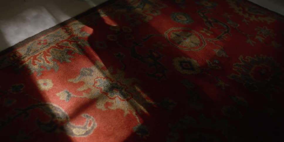 A shadow of a child is dancing by the window