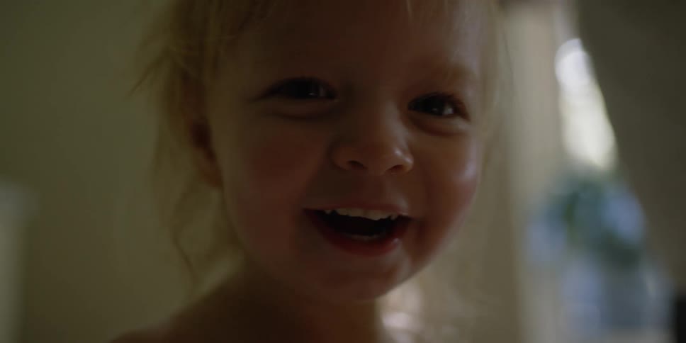 A close up portrait of a child that is happy