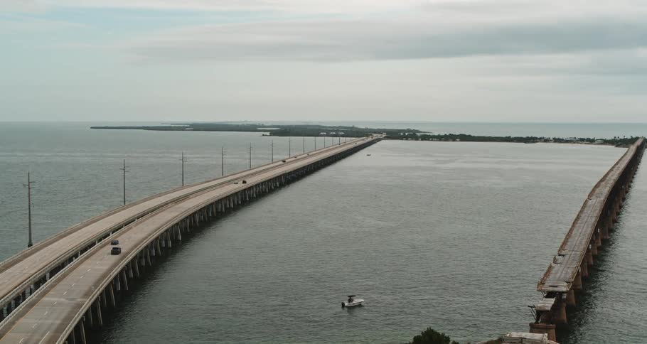 An aerial view of a road over water