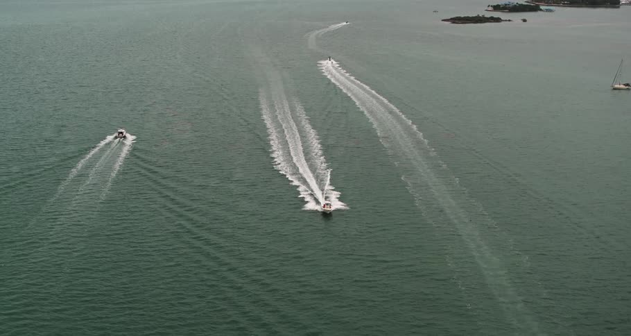 Boats driving in water