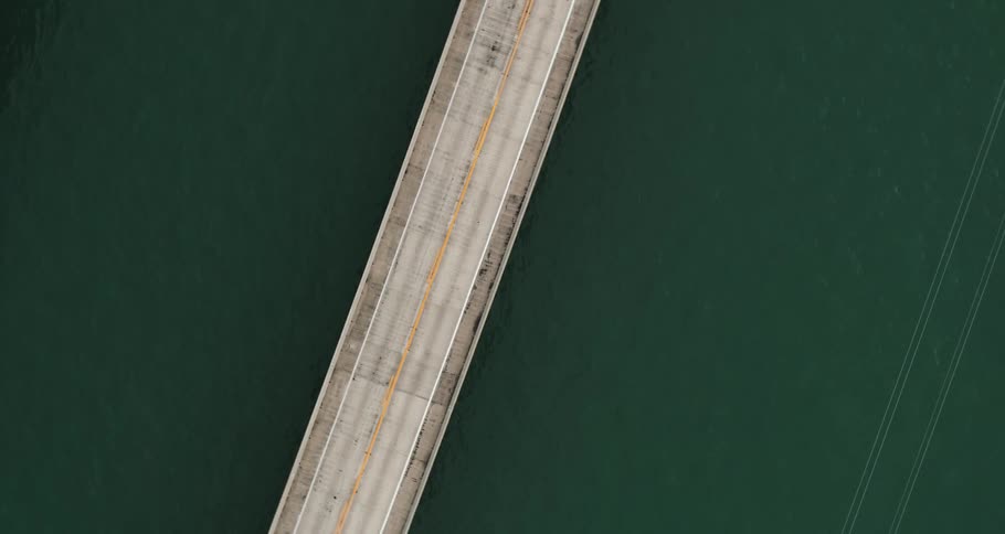 A bridge with vehicles over water