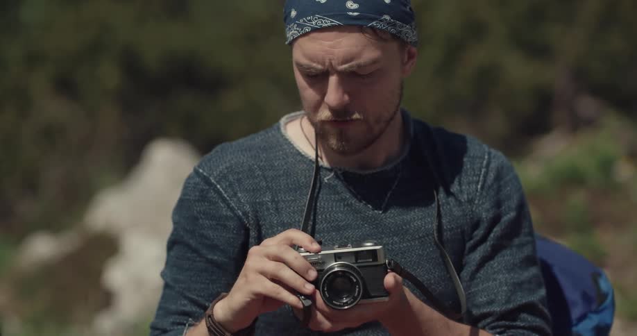 Man taking photos of woman