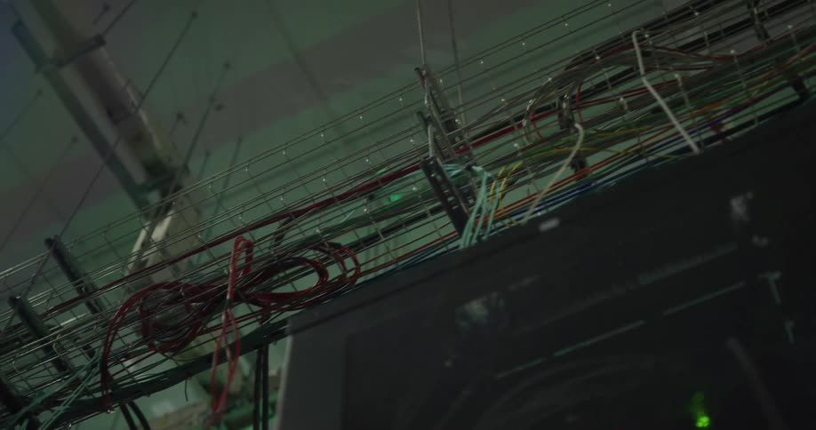 Cables inside a rack suspended from the ceiling on a server room