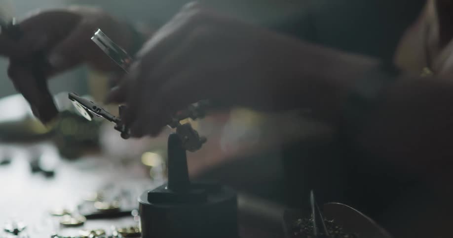 A woman working on jewelry