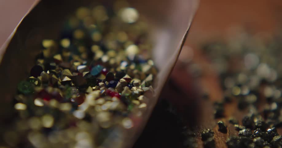 A table with a container and crystals