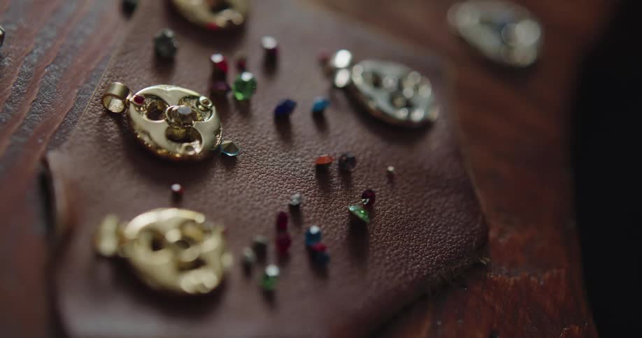 Jewelry settings on a leather patch