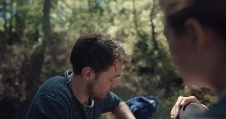 A man and woman are camping together