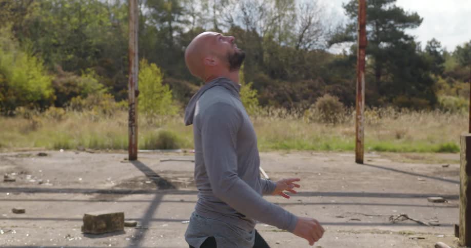 A man playing with a soccer ball outdoors